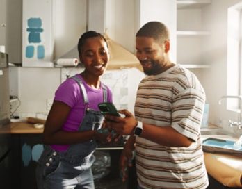 man and a woman in a kitchen that is being renovated
